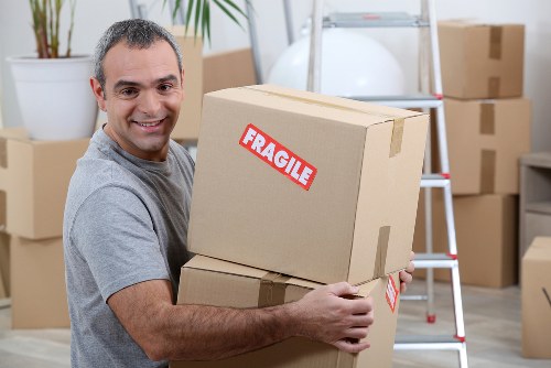Removal team planning a local move in Catford with boxes and furniture
