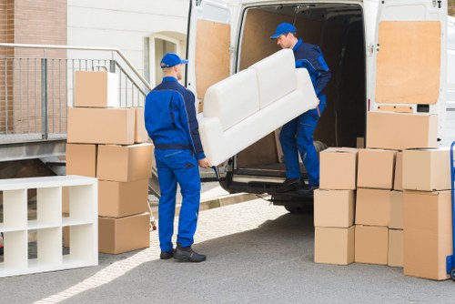 Commercial moving team handling office equipment
