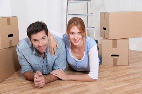 Professional removal team handling household furniture and boxes during a Catford relocation