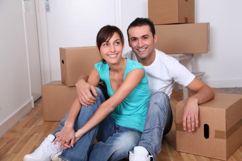 Loading furniture into a moving truck in Catford