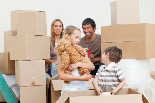 Movers carefully loading household items for a Catford relocation